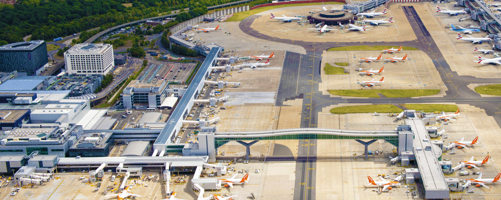 An aerial photograph of London Gatwick from the east, with Pier 6 and Pier 3